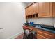 Office nook area featuring built-in cabinets and desk area, offering a quiet workspace at 3157 Perimeter Cir, Buford, GA 30519