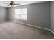 Open bedroom with plush carpet, neutral paint, and a large window for natural lighting at 4228 Lakes End Nw Dr, Kennesaw, GA 30144