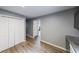 Hallway featuring modern flooring, closet and grey paint at 4228 Lakes End Nw Dr, Kennesaw, GA 30144