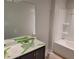 Bathroom featuring single vanity with large mirror and a shower-tub combination at 45 Avian Way, Auburn, GA 30011