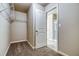 A walk-in closet with wire shelving and carpet; view of the bathroom with white tile at 45 Avian Way, Auburn, GA 30011