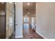 Inviting entryway featuring wood-look flooring and a view into the open-concept living space with natural light at 45 Avian Way, Auburn, GA 30011