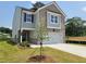 Charming two-story home with brick and siding exterior and a two-car garage at 45 Avian Way, Auburn, GA 30011
