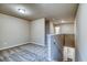 Carpeted loft space featuring a view of the staircase, neutral walls, and ample natural light at 45 Avian Way, Auburn, GA 30011