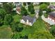 Aerial view of the home surrounded by mature trees and well manicured lawn at 16 Kentucky Ne Walk, Cartersville, GA 30121