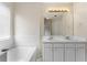 Bathroom showing a soaking tub, a large mirror, and tile accents at 16 Kentucky Ne Walk, Cartersville, GA 30121