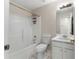 Bright bathroom featuring a white tub and shower combination and a white vanity at 16 Kentucky Ne Walk, Cartersville, GA 30121