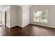 Cozy bedroom with new floors, neutral paint, and a large window overlooking the landscaped yard at 16 Kentucky Ne Walk, Cartersville, GA 30121