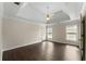 Spacious primary bedroom boasts new floor and access to private backyard patio at 16 Kentucky Ne Walk, Cartersville, GA 30121