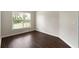 Neutral bedroom with new floors and a large window with backyard views at 16 Kentucky Ne Walk, Cartersville, GA 30121