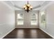 Dining room with wood floors, trim, chandelier and natural lighting at 16 Kentucky Ne Walk, Cartersville, GA 30121