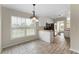 Bright eat-in kitchen area featuring a large window, breakfast bar, and stainless steel appliances at 16 Kentucky Ne Walk, Cartersville, GA 30121