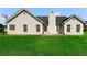 Rear exterior view of home showcasing vinyl siding and lush green lawn at 16 Kentucky Ne Walk, Cartersville, GA 30121
