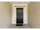 Close-up of the home's front door with sidelights, showcasing a clean and welcoming entrance at 16 Kentucky Ne Walk, Cartersville, GA 30121