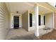 Cozy front porch with welcoming 'welcome' sign, classic black door, and neat landscaping at 16 Kentucky Ne Walk, Cartersville, GA 30121