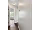Hallway featuring hardwood flooring and views of a bright, windowed room at 16 Kentucky Ne Walk, Cartersville, GA 30121