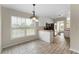 Bright breakfast nook with large windows adjacent to a modern kitchen area at 16 Kentucky Ne Walk, Cartersville, GA 30121