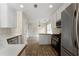 Bright kitchen features modern appliances and leads to the dining area at 16 Kentucky Ne Walk, Cartersville, GA 30121