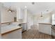 Well-lit kitchen features white cabinets, tiled floors, and a breakfast bar with stylish pendant lighting at 16 Kentucky Ne Walk, Cartersville, GA 30121