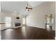 Bright living room with a fireplace, fan, hardwood floors, and ample natural light at 16 Kentucky Ne Walk, Cartersville, GA 30121
