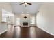 Bright living room with hardwood floors and fireplace opens to the kitchen at 16 Kentucky Ne Walk, Cartersville, GA 30121