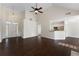 Open-concept living room features a vaulted ceiling, modern ceiling fan and view of the entry at 16 Kentucky Ne Walk, Cartersville, GA 30121