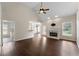 Spacious living room with a fireplace, ceiling fan, and hardwood floors at 16 Kentucky Ne Walk, Cartersville, GA 30121