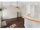 Bright living room features a ceiling fan, fireplace and breakfast bar overlooking a modern kitchen at 16 Kentucky Ne Walk, Cartersville, GA 30121