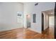 Bright bedroom featuring hardwood floors and ensuite bathroom with gray vanity at 165 Breakspear Ln, Fayetteville, GA 30214
