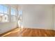Bright bedroom with hardwood floors, white walls, white trim, and natural light through multiple windows at 165 Breakspear Ln, Fayetteville, GA 30214