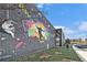 A large, vibrant mural adds a unique touch to this community's recreational building at 165 Breakspear Ln, Fayetteville, GA 30214
