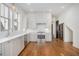 Bright kitchen featuring white cabinets, stainless steel appliances, and hardwood floors at 165 Breakspear Ln, Fayetteville, GA 30214