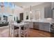 Eat-in kitchen with stainless steel appliances, hardwood floors, and ample natural light at 165 Breakspear Ln, Fayetteville, GA 30214