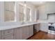 Kitchen with marble countertops, stainless steel appliances, and hardwood floors at 165 Breakspear Ln, Fayetteville, GA 30214