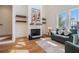 Living room with fireplace, hardwood floors, and modern decor at 165 Breakspear Ln, Fayetteville, GA 30214