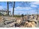 Relaxing park benches near a stone fire pit, perfect for community gatherings and outdoor enjoyment at 165 Breakspear Ln, Fayetteville, GA 30214