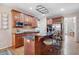 Traditional kitchen with wood cabinets, granite countertops, island with seating, and modern stainless steel appliances at 4651 Oakleigh Manor Dr, Powder Springs, GA 30127