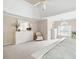 Bright main bedroom featuring a ceiling fan, carpet, neutral walls, and white furniture at 4651 Oakleigh Manor Dr, Powder Springs, GA 30127