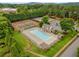 Aerial view of community pool and tennis courts surrounded by lush landscaping at 1355 Pinebreeze Way, Marietta, GA 30062
