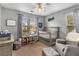 Charming bedroom with neutral tones, a crib, rocking chair, and ample natural light at 1355 Pinebreeze Way, Marietta, GA 30062