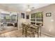 Inviting dining area with view to living space, featuring a wooden table and tile flooring at 1355 Pinebreeze Way, Marietta, GA 30062