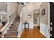 Inviting foyer with hardwood floors, staircase, and elegant wainscoting at 1355 Pinebreeze Way, Marietta, GA 30062