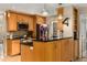 Gourmet kitchen with custom wood cabinets, granite countertops, and stainless steel appliances at 1355 Pinebreeze Way, Marietta, GA 30062