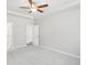 Inviting bedroom with soft carpet, ceiling fan, and a glimpse into the en suite bathroom at 189 Park Ln, Fairburn, GA 30213