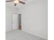 Cozy bedroom with neutral carpet and a ceiling fan, providing a comfortable living space at 189 Park Ln, Fairburn, GA 30213