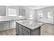 Open concept kitchen featuring granite island and stainless steel appliances at 189 Park Ln, Fairburn, GA 30213