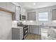 Kitchen featuring stainless steel appliances, granite countertops and white subway tile backsplash at 189 Park Ln, Fairburn, GA 30213