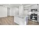 Bright new kitchen featuring granite countertops, stainless steel appliances, and wooden floor at 189 Park Ln, Fairburn, GA 30213