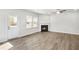 New construction open living area with rear door, fireplace, and bright light at 189 Park Ln, Fairburn, GA 30213