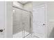 Modern bathroom with a glass-enclosed shower, tiled walls, and a crisp, clean design at 189 Park Ln, Fairburn, GA 30213